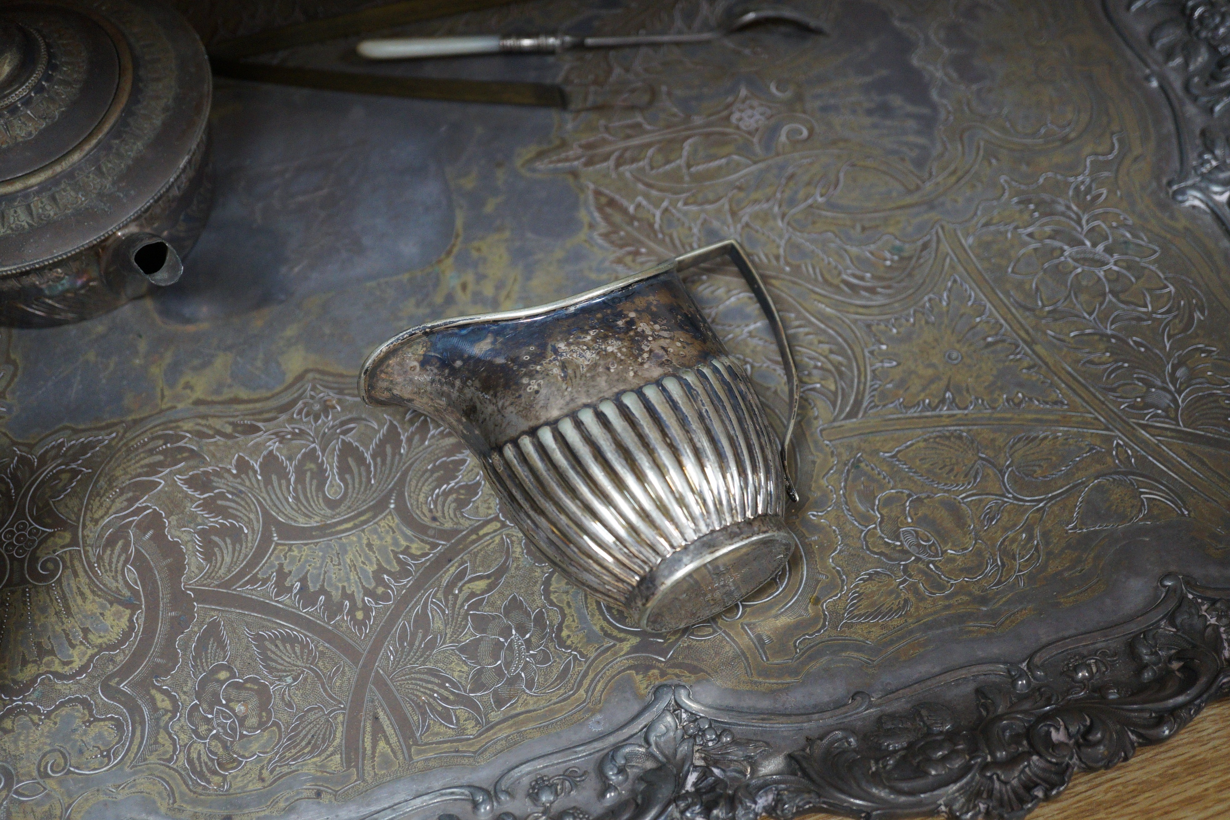 A silver plated two handled tea tray and seven other plated items, tray length 80cm